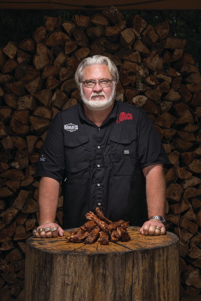 Championship BBQ ribs over glowing embers and smoke
